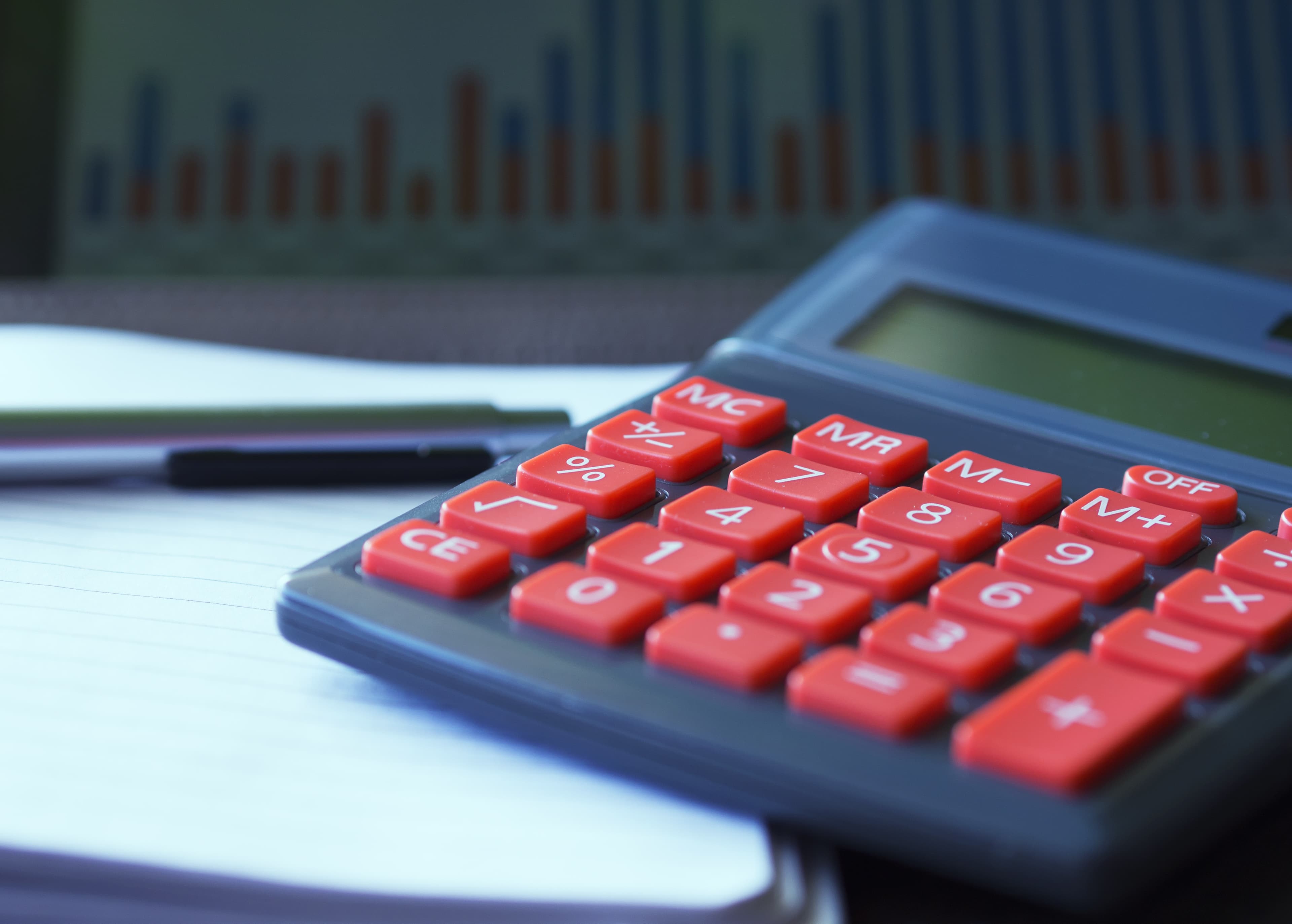 Calculator and financial chart representing lease accounting under IFRS 16